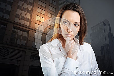 Pensive young woman thinking about something serious Stock Photo