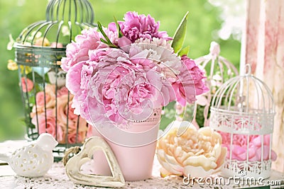Peony bunch in vase on the table in the garden Stock Photo