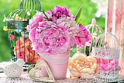 Peony bunch in vase on the table in the garden Stock Photo