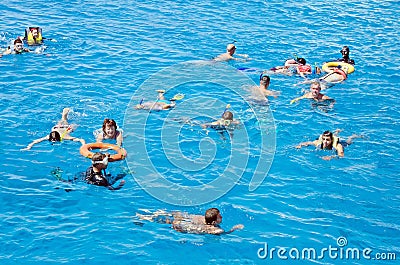 People actively relax, swim in the Red Sea. Activity, Swimming, Water landscape. Egypt, Africa Editorial Stock Photo