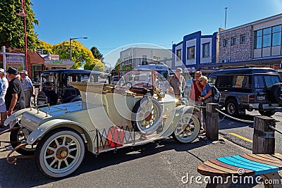 People admiring a vintage car at a show in Motueka High Street in front of the museum Editorial Stock Photo