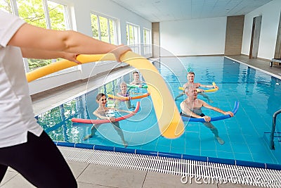 People in aqua fitness class during a physical therapy session Stock Photo