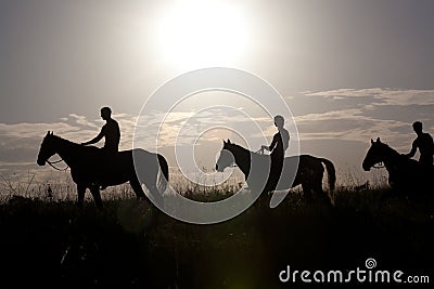 People astride horses Stock Photo