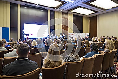 People Attending Business Conference Sitting in Front of the Host Editorial Stock Photo