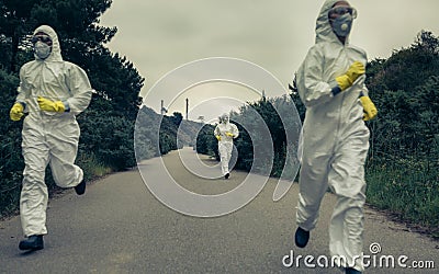 People with bacteriological protection suits running Stock Photo
