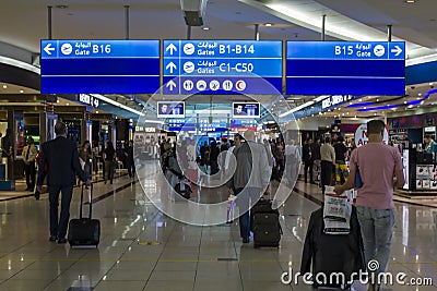 People with baggage walking in Airport duty free area Editorial Stock Photo