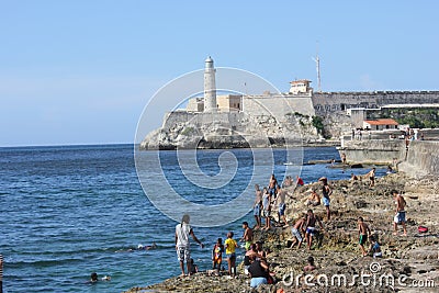 People bathing and the Castle of the Royal Force, Havana Editorial Stock Photo