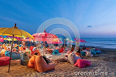 People at the beach drinking at a kuta beach bar Editorial Stock Photo