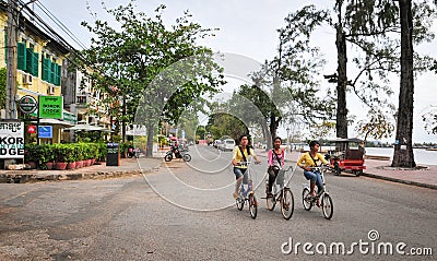People biking on street in Kampot, Cambodia Editorial Stock Photo