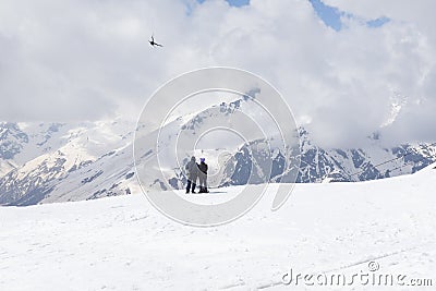 People and bird in the mountains of the North Caucasus in winter, snow Editorial Stock Photo