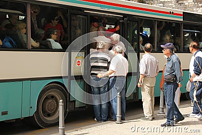 People boarding an overcrowded bus. Split. Croatia Editorial Stock Photo