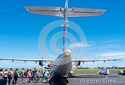 People boarding plane at Tahiti airport Editorial Stock Photo