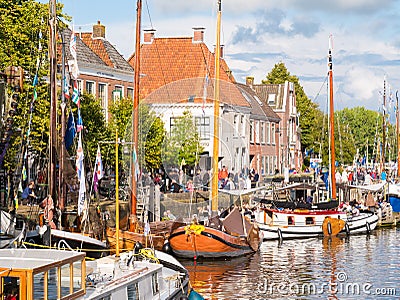 People and boats during Admiralty Days of Dokkum, Friesland, Net Editorial Stock Photo