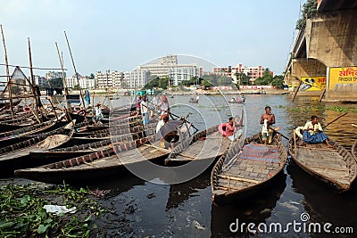 People on both sides of the Buriganga river in Dhaka cross the river by traditional boat. Editorial Stock Photo