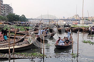 People on both sides of the Buriganga river in Dhaka cross the river by traditional boat. Editorial Stock Photo