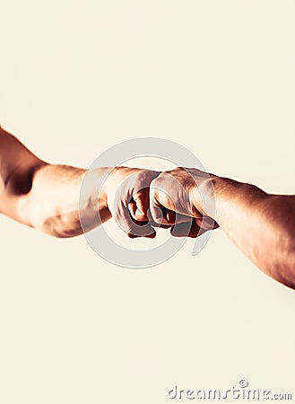 People bumping their fists together, arms. Friendly handshake, friends greeting. Hands of man people fist bump team Stock Photo