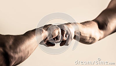 People bumping their fists together, arms. Friendly handshake, friends greeting. Man giving fist bump. Hands of man Stock Photo