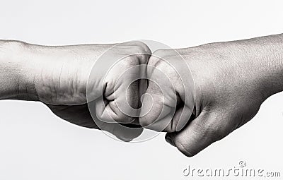People bumping their fists together, arms. Man giving fist bump. Team concept. Hands of man people fist bump team Stock Photo