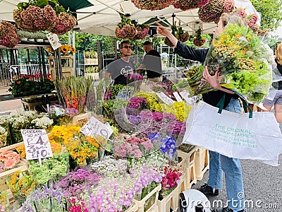 People buying plants at the Columbia road flower market London , Uk Editorial Stock Photo
