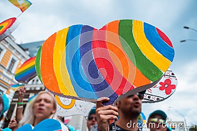 People carry lgbt hearts at the LGBT parade Editorial Stock Photo