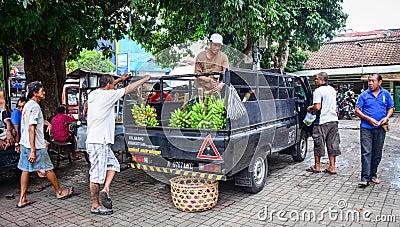 People carrying fresh fruits to the market in Bali, Indonesia Editorial Stock Photo