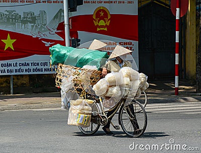 People carrying goods on street in Dalat, Vietnam Editorial Stock Photo