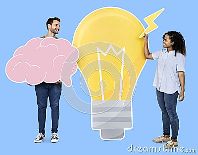 People carrying a light bulb and a brain icons Stock Photo