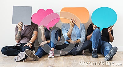 People carrying speech bubble icons Stock Photo