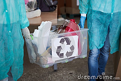 People carrying transparent container Stock Photo
