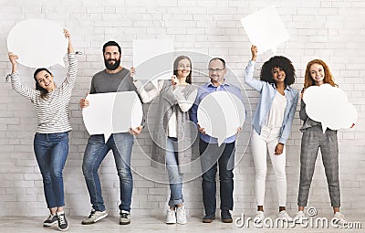 People carryng speech bubble icons at studio Stock Photo