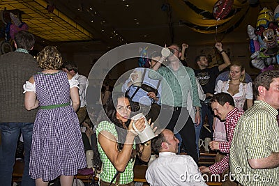 People celebrating on the famous Munich Strong Beer Festival. Editorial Stock Photo