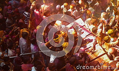 People celebrating holi the festival of colours inside a temple, Editorial Stock Photo