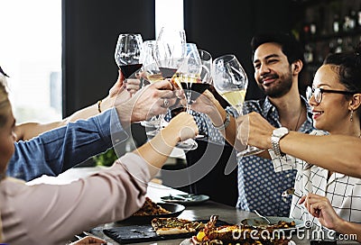People cheers a wine glasses together Stock Photo