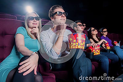 People in the cinema wearing 3d glasses Stock Photo
