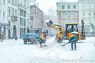 People cleaning city streets after snowstorm Editorial Stock Photo