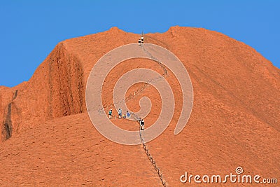 People climbing on Ayers Rock in Uluru-Kata Tjuta National Park Northern Territory Australia Editorial Stock Photo