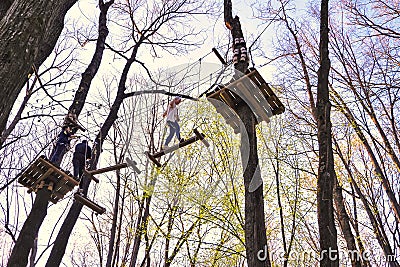 People climbing the obstacles in the trees Editorial Stock Photo
