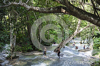 People climbing up Dunn`s River Falls, Jamaica Editorial Stock Photo