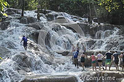 People climbing up Dunn`s River Falls, Jamaica Editorial Stock Photo