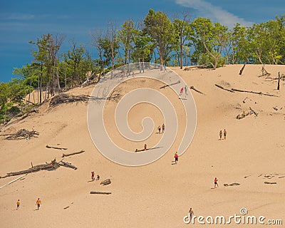 People climbing the Warren Dunes Stock Photo