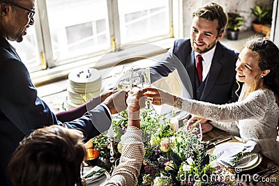 People Cling Wine Glasses on Wedding Reception with Bride and Gr Stock Photo