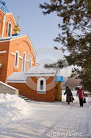 People come out of the cathedral with blessed water Editorial Stock Photo