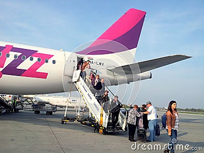 People coming out from a Wizzair plane Editorial Stock Photo