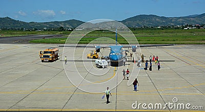 People coming to the airplane at airport in Dalat, Vietnam Editorial Stock Photo