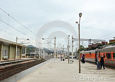 People coming to the train at station in Chiayi, Taiwan Editorial Stock Photo