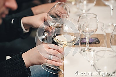 People consider the color of the wine and try how it smells in different glasses Stock Photo