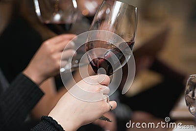 People consider the color of the wine and try how it smells in different glasses Stock Photo