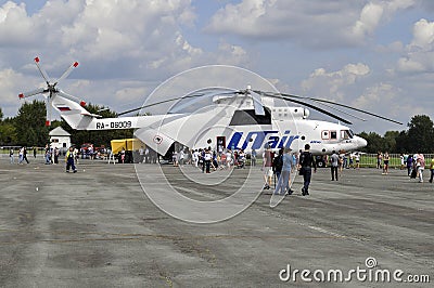 People consider the helicopter of the UTair company at an air sh Editorial Stock Photo
