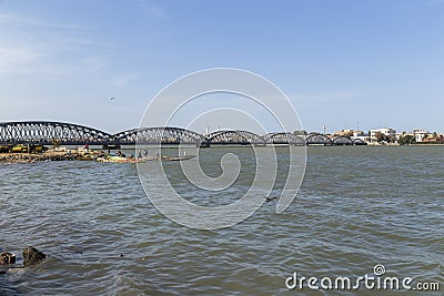 people cross the Faidherber bridge Editorial Stock Photo