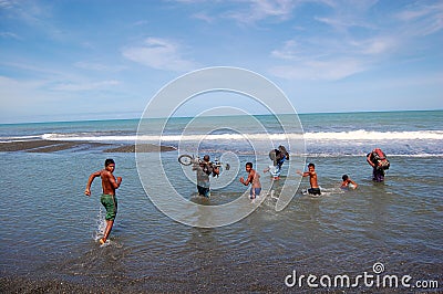 People cross river at sea coast Editorial Stock Photo